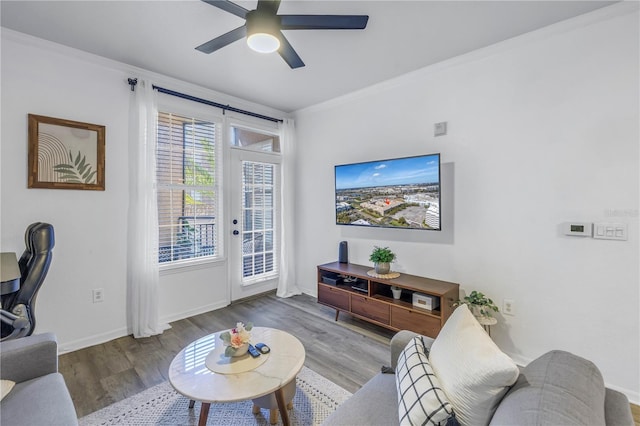 4221 W Spruce St Unit 1325, Tampa, FL 33607 - living room with crown molding, ceiling fan, and light hardwood / wood-style floors