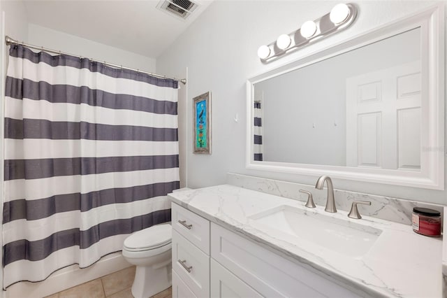 bathroom featuring vanity, toilet, curtained shower, and tile patterned flooring