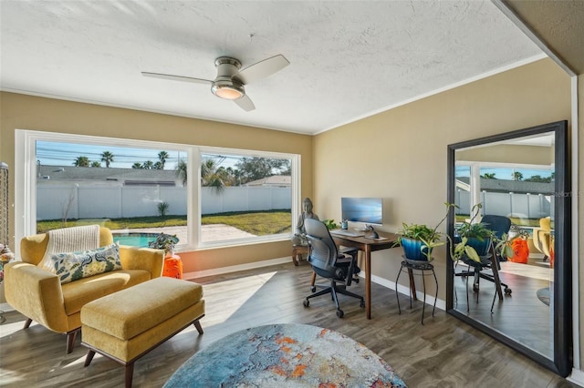 sunroom featuring ceiling fan