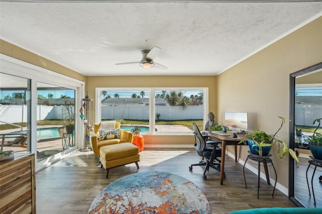 sunroom / solarium with ceiling fan