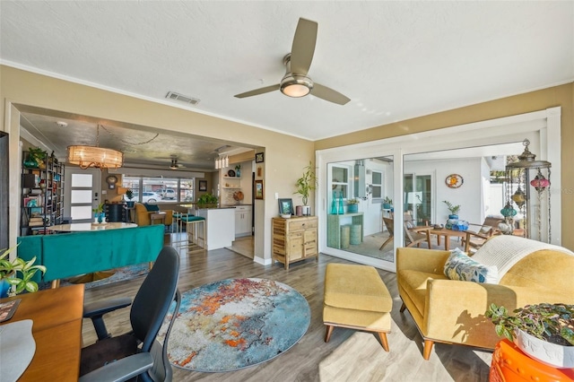 interior space featuring wood-type flooring, ceiling fan, and french doors