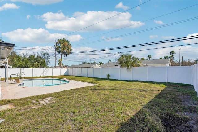 view of pool featuring a yard and a patio area