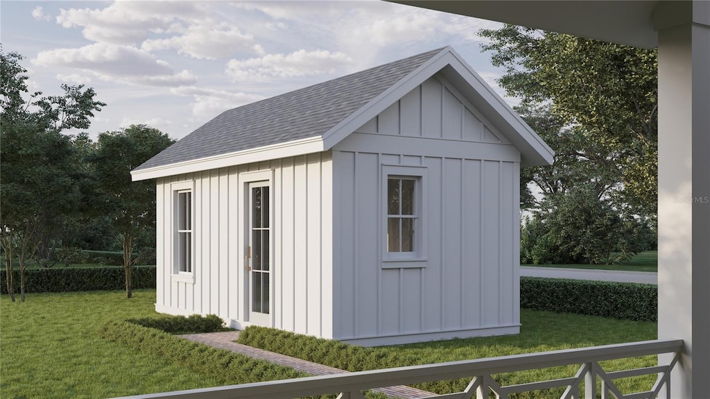 view of outbuilding with a yard