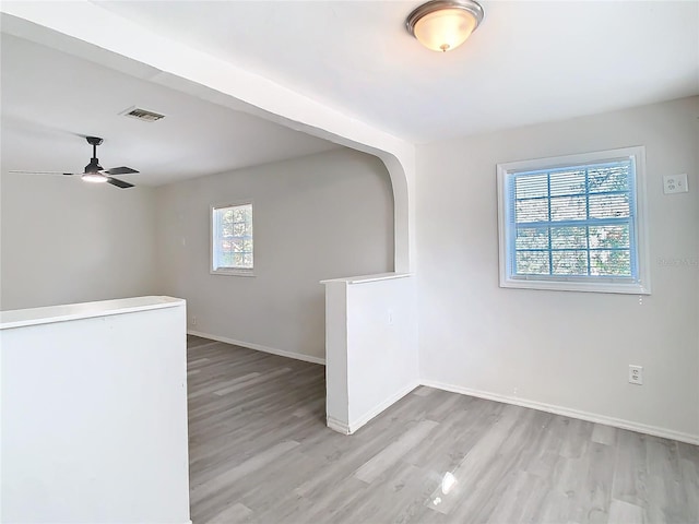 spare room with ceiling fan and light hardwood / wood-style flooring