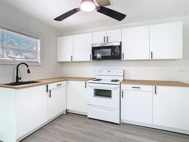 kitchen with white cabinetry, sink, white electric stove, and ceiling fan