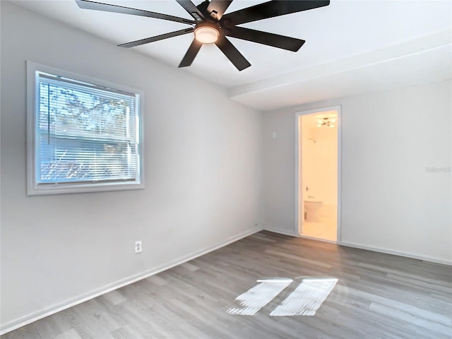 unfurnished room featuring light hardwood / wood-style flooring and ceiling fan