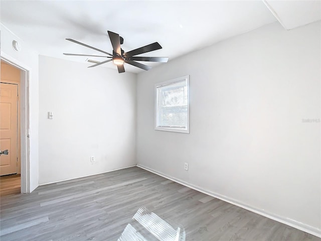 unfurnished room featuring ceiling fan and wood-type flooring