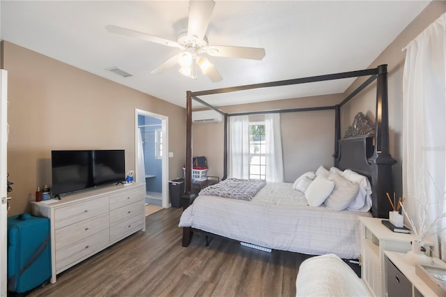 bedroom with dark hardwood / wood-style flooring, ceiling fan, and a wall unit AC