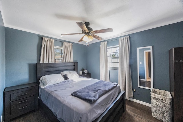 bedroom featuring dark wood-type flooring and ceiling fan