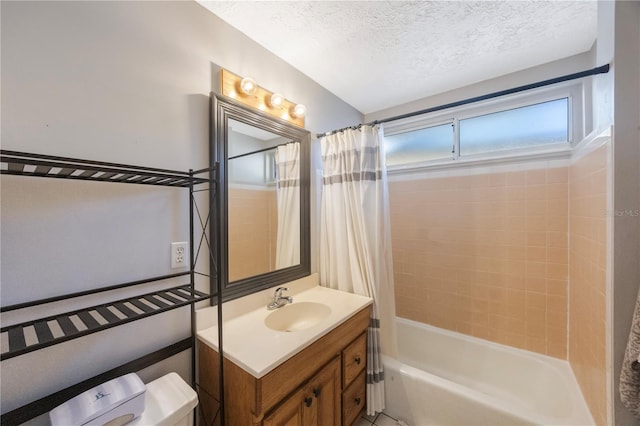 bathroom with vanity, shower / bath combination with curtain, and a textured ceiling