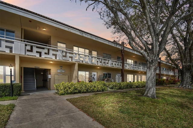 view of outdoor building at dusk