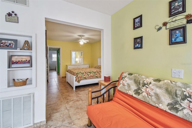 tiled bedroom featuring ceiling fan