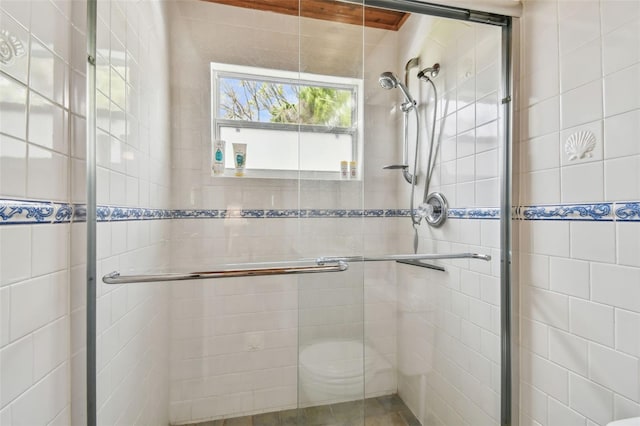 bathroom featuring an enclosed shower