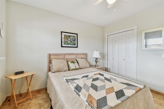bedroom featuring light tile patterned flooring, ceiling fan, and a closet