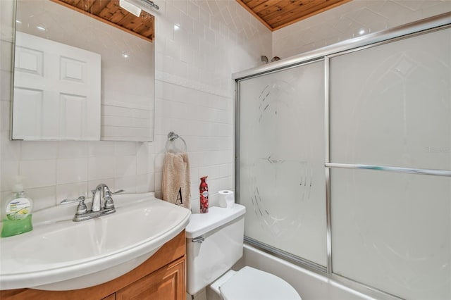 full bathroom featuring tasteful backsplash, tile walls, enclosed tub / shower combo, vanity, and toilet