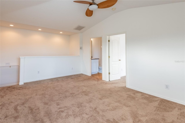 spare room with visible vents, lofted ceiling, carpet flooring, recessed lighting, and a ceiling fan