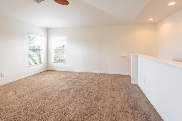 unfurnished room with recessed lighting, baseboards, light colored carpet, and a ceiling fan