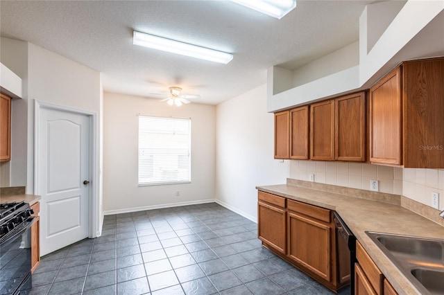 kitchen with a ceiling fan, brown cabinetry, a sink, black appliances, and tasteful backsplash