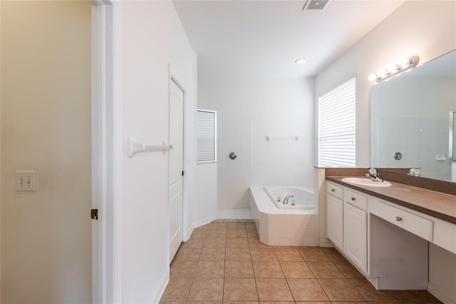 full bathroom with tile patterned floors, a garden tub, vanity, and a tile shower