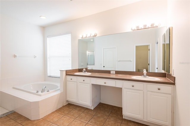 bathroom featuring tile patterned floors, a bath, double vanity, and a sink