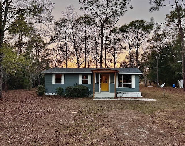 single story home featuring covered porch