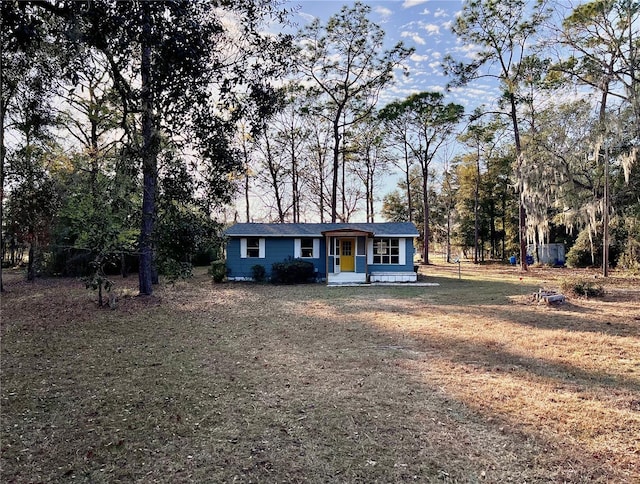 ranch-style house with a front yard