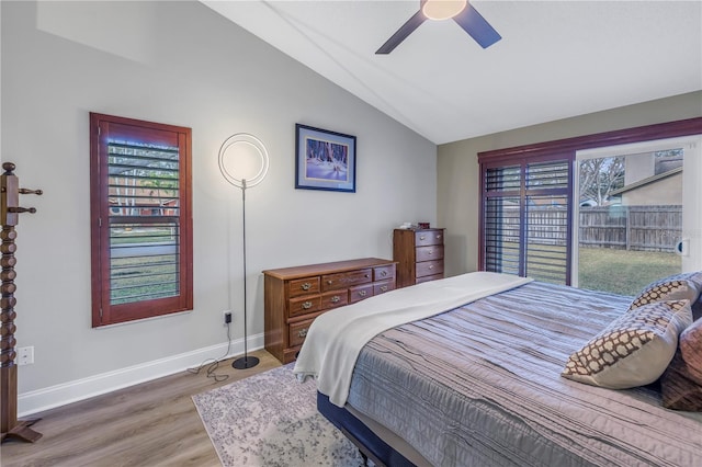 bedroom featuring ceiling fan, lofted ceiling, and wood-type flooring