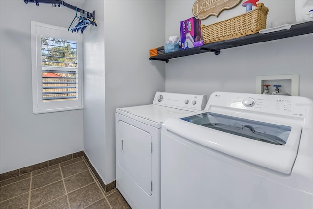 clothes washing area featuring separate washer and dryer