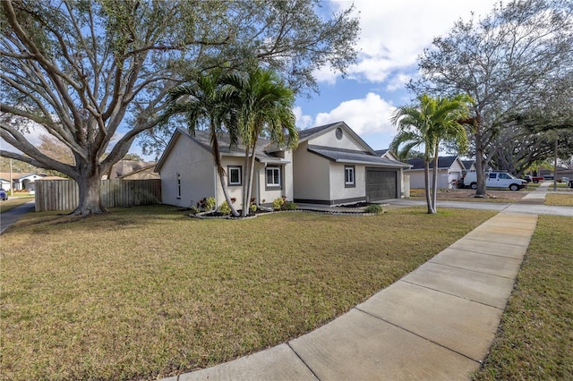 single story home featuring a garage and a front lawn