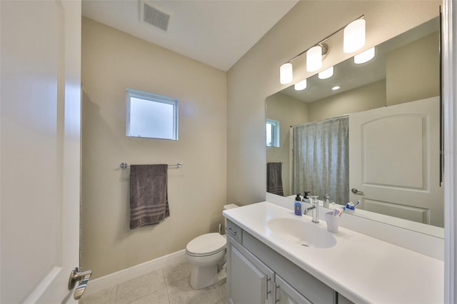 full bath with visible vents, toilet, vanity, tile patterned flooring, and baseboards