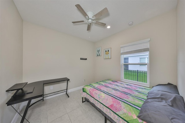 bedroom featuring light tile patterned floors and ceiling fan