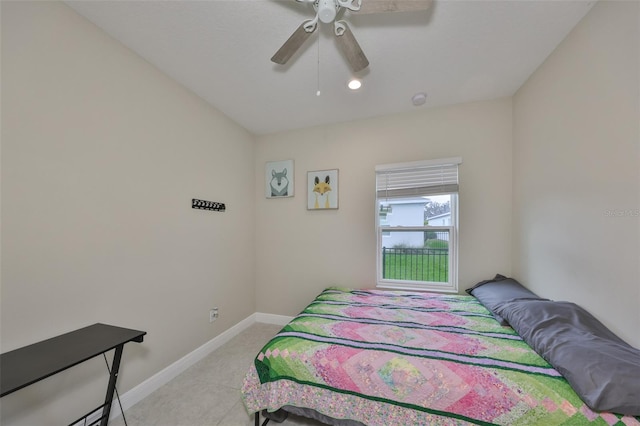 bedroom featuring a ceiling fan and baseboards