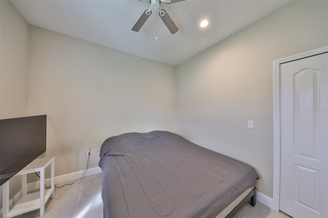 bedroom featuring a ceiling fan and baseboards