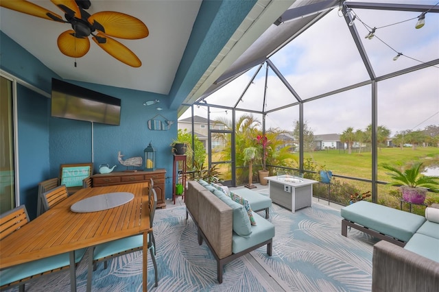 sunroom / solarium with plenty of natural light and ceiling fan