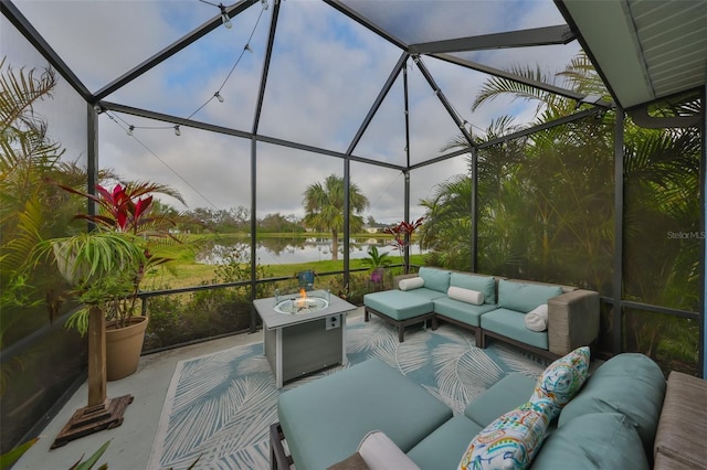 view of patio / terrace featuring a lanai, outdoor lounge area, and a water view