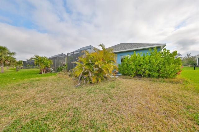 view of yard with a lanai