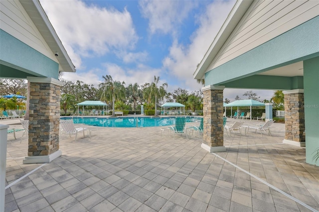 community pool featuring a patio area and a gazebo