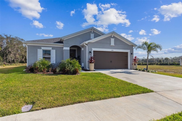 single story home featuring a garage and a front yard