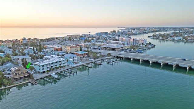 aerial view at dusk with a water view