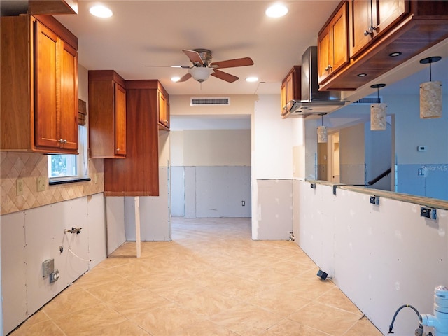 kitchen with tasteful backsplash, hanging light fixtures, and ceiling fan