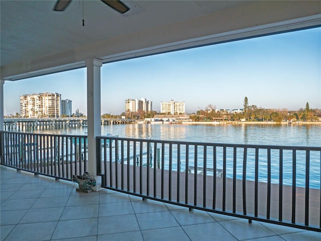 exterior space with a water view and ceiling fan