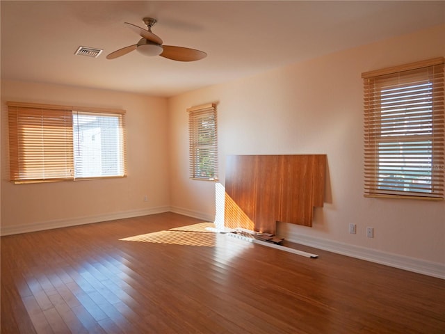 unfurnished room with wood-type flooring and ceiling fan