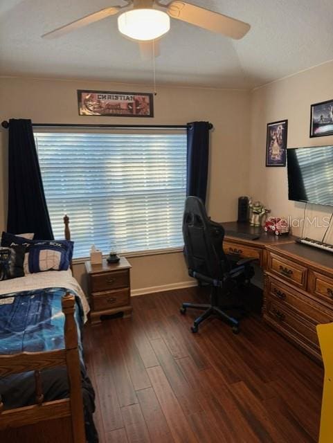 bedroom with ceiling fan and dark hardwood / wood-style floors