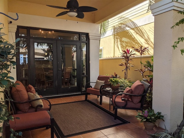 entrance to property featuring ceiling fan and french doors