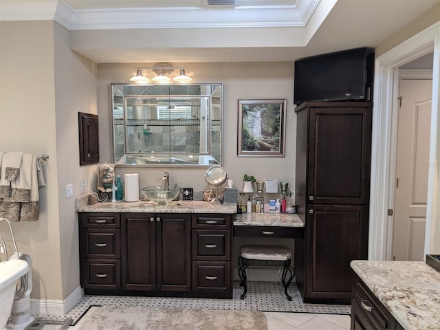 bathroom featuring vanity, crown molding, and tile patterned floors