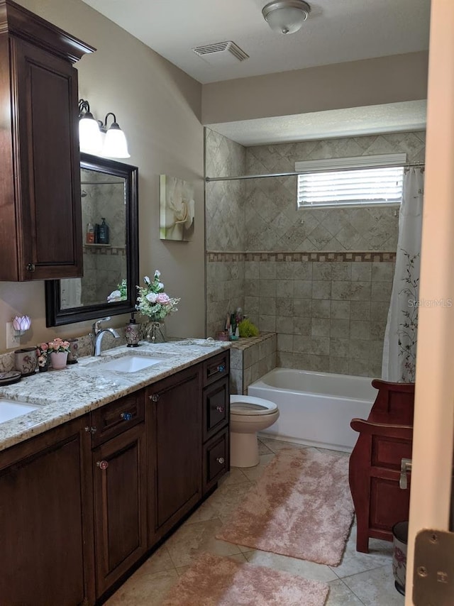 full bathroom featuring tile patterned flooring, vanity, shower / bathtub combination with curtain, and toilet