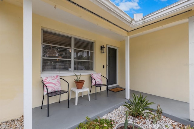 entrance to property with stucco siding