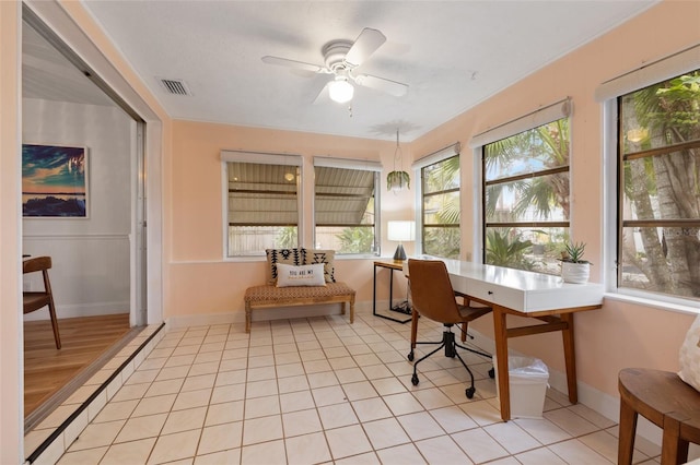 office area with baseboards, visible vents, a ceiling fan, and light tile patterned flooring