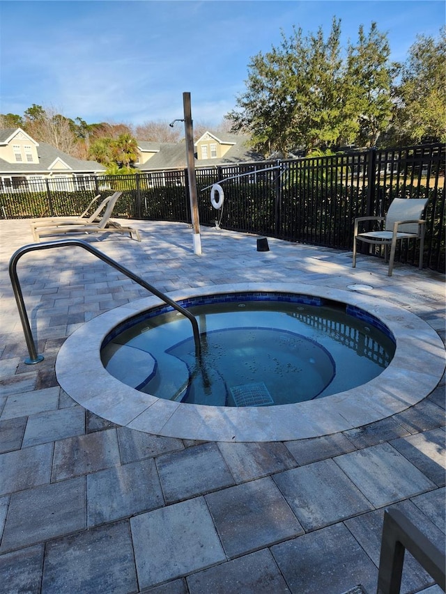 view of pool featuring an in ground hot tub and a patio area