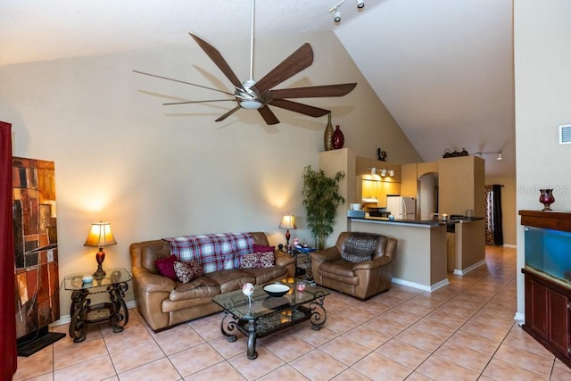 tiled living room featuring ceiling fan, track lighting, and high vaulted ceiling